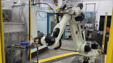  A robotic arm moves amongst AMPF facilities